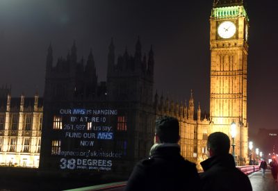 NHS documentary projected on parliament