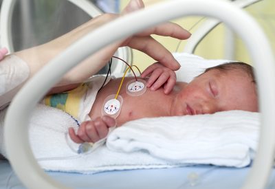 Newborn baby in incubator