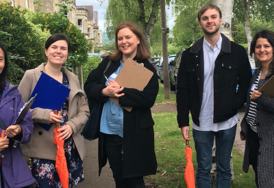 38 Degrees members smile on the street in a canvassing session