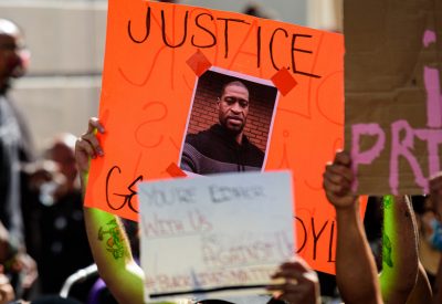 A poster from which says "justice for George Floyd"