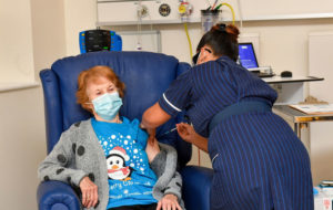 Photograph of grandmother Margaret Keenan receiving the first Covid-19 vaccine in the UK.