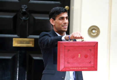 Rishi Sunak holds up a red briefcase outside number 11 Downing Street