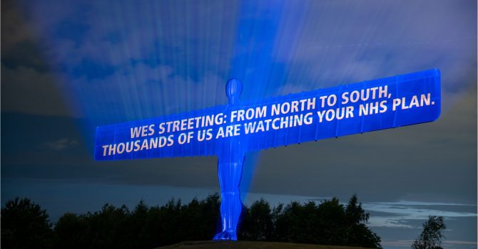 Projected onto the Angel of the North: "Wes Streeting: from North to South: thousands of us are watching your NHS plan"