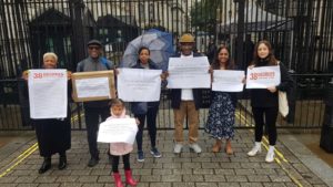 image of windrush campaigners at downing street