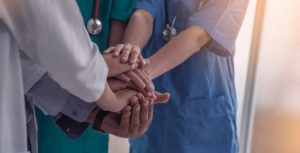 nurses holding hands