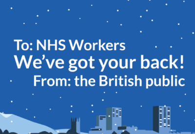 An image of a blue postcard with the image of a hospital surrounded by snow and the message: "To NHS workers, we