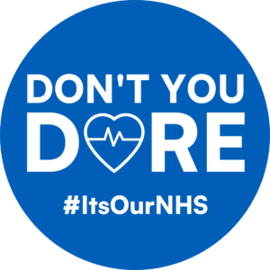 Blue circle with white text reading DON'T YOU DARE #ItsOurNHS. The A of DARE is a heart.