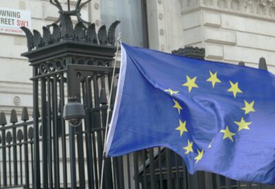 A blue and yellow European flag flies outside Downing Street