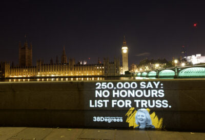 Projection reading 250,000 say no honours list for Truss. Westminster in background.