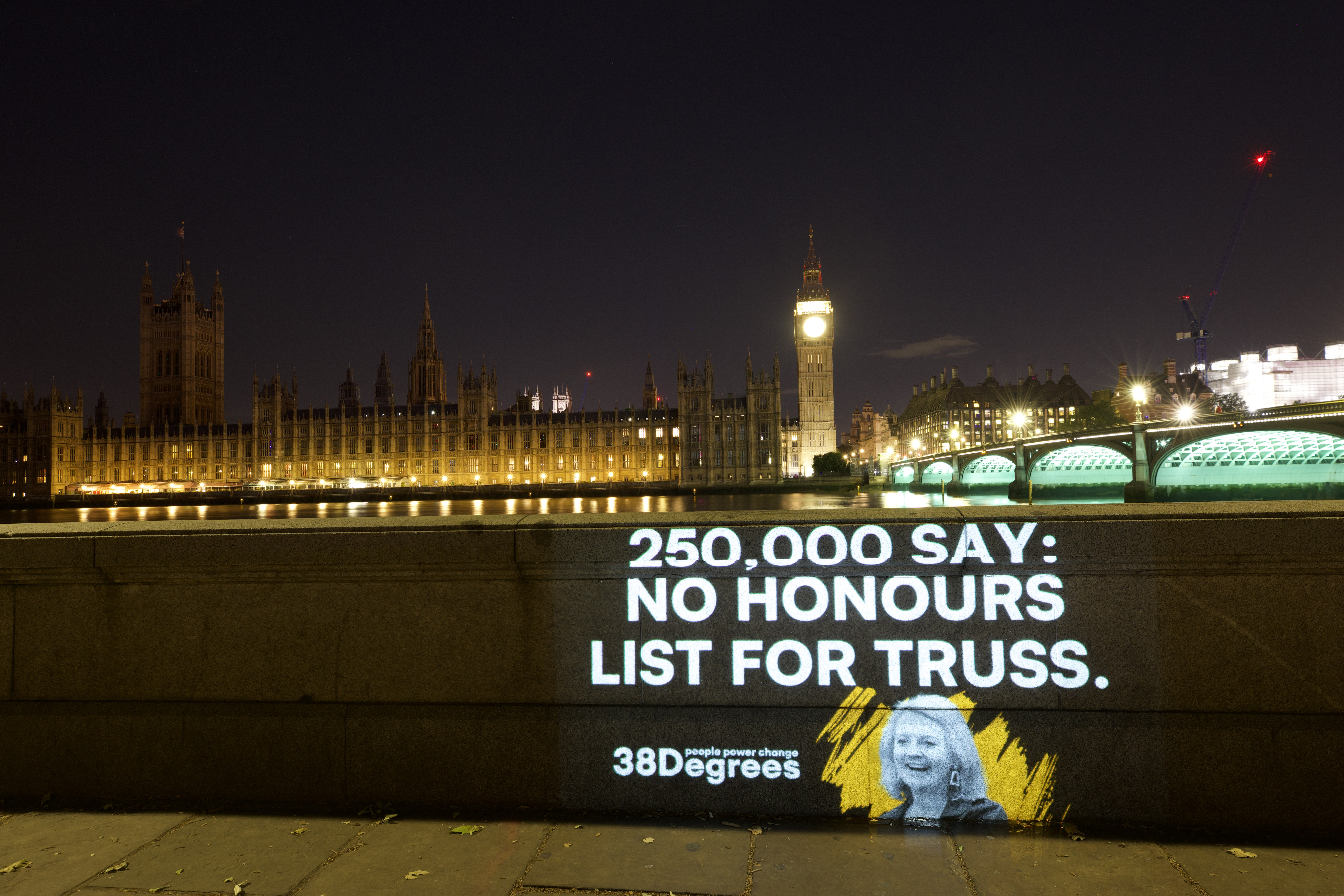 Projection reading 250,000 say no honours list for Truss. Westminster in background.