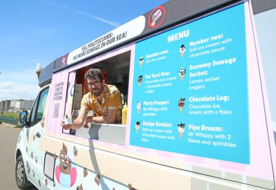 An ice cream van covered in images of sewage
